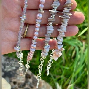 Set of 4 Violet Seas bracelets w/ charms